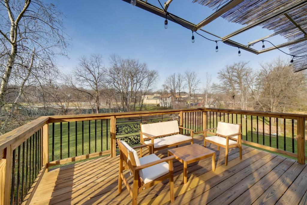 a deck with two chairs and a table and chairs at Spacious Rockford Retreat Walk Downtown! in Rockford
