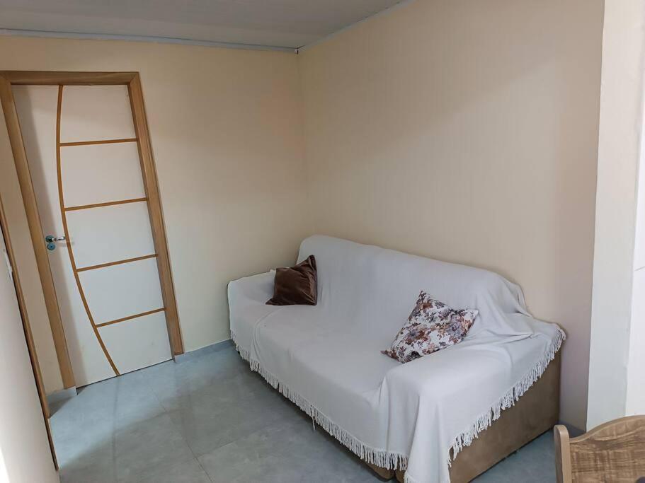 Postel nebo postele na pokoji v ubytování Quitinete do Amorim 2