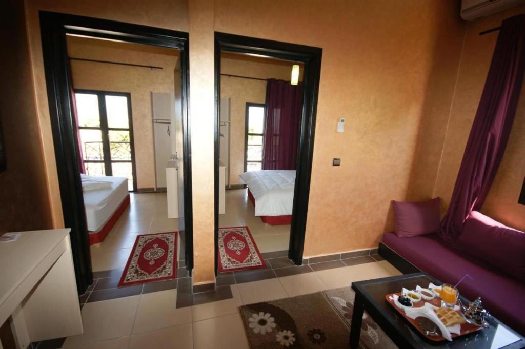 Postel nebo postele na pokoji v ubytování INOU Hotel
