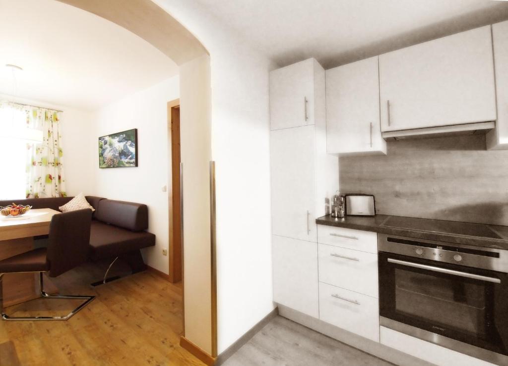 Kuchyň nebo kuchyňský kout v ubytování Alpenapartments Unterschlag