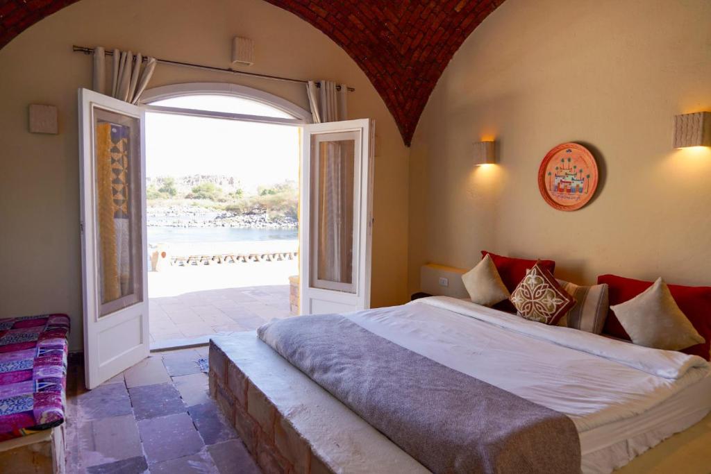 Postel nebo postele na pokoji v ubytování Artika Wadi Kiki Hotel