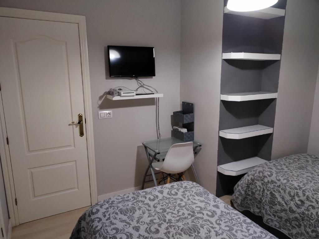 Posteľ alebo postele v izbe v ubytovaní Apartamento con parking privado gratis incluido