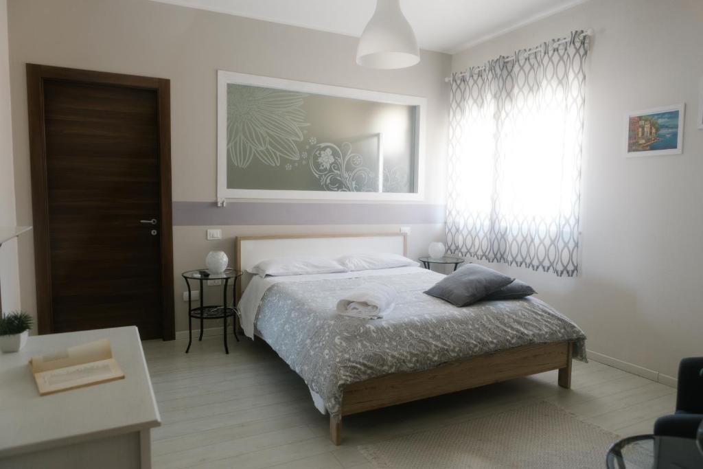 Postel nebo postele na pokoji v ubytování B&B Geolja
