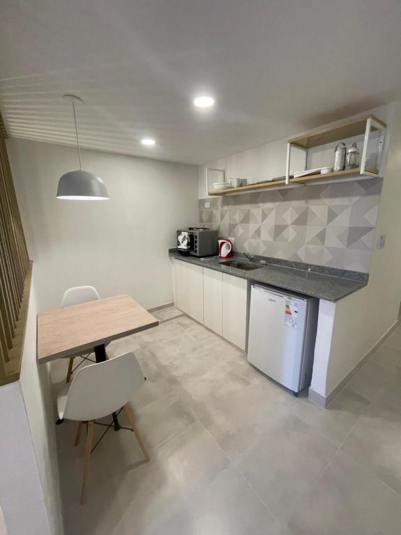 a kitchen with a table and a counter top at Florencia in Termas de Río Hondo