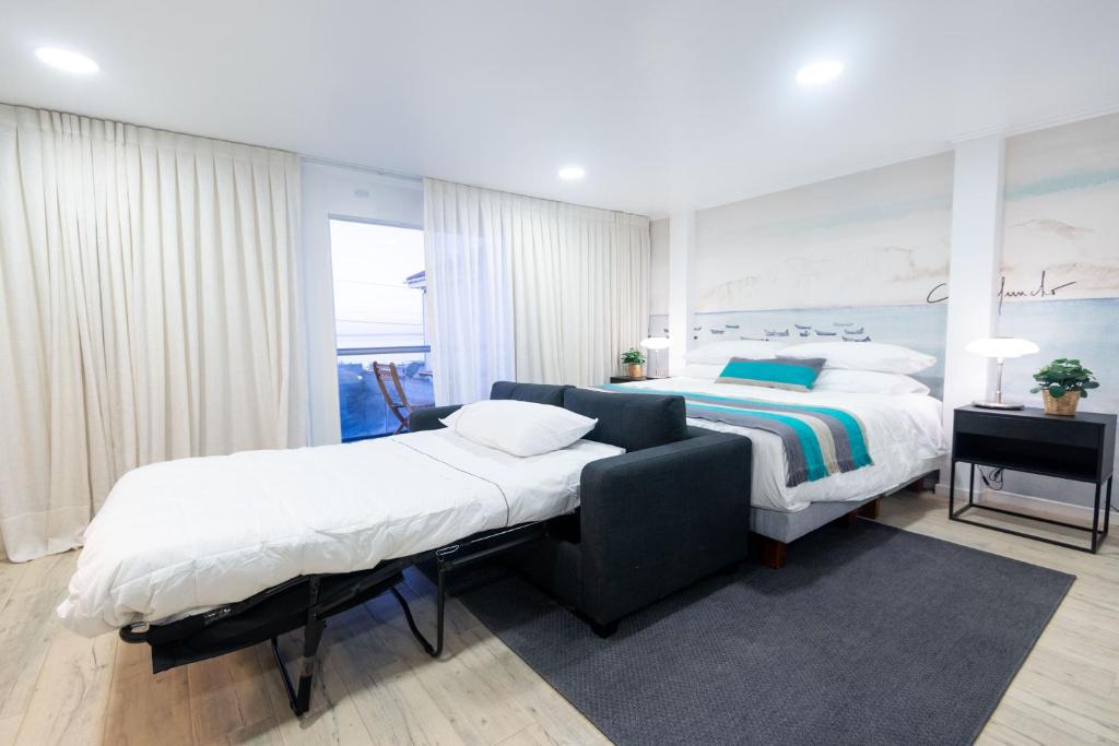 Postel nebo postele na pokoji v ubytování Nolana hotel