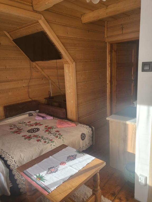 Posteľ alebo postele v izbe v ubytovaní Domek Jelonek
