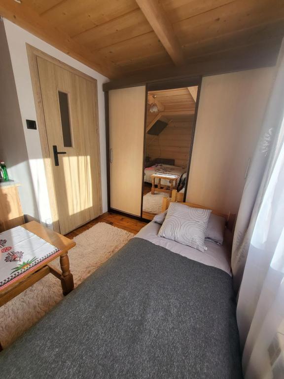 Posteľ alebo postele v izbe v ubytovaní Domek Jelonek