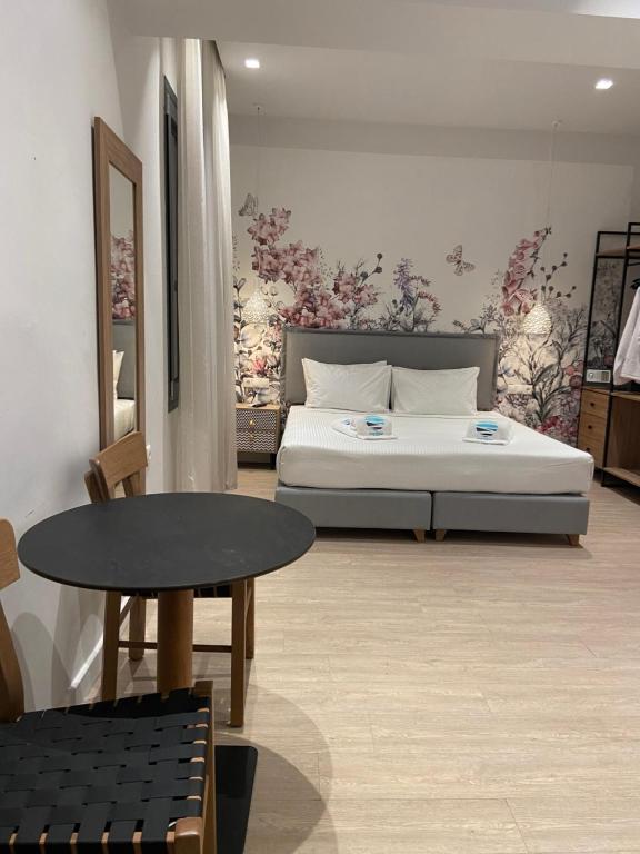 Postel nebo postele na pokoji v ubytování Maritime Suites