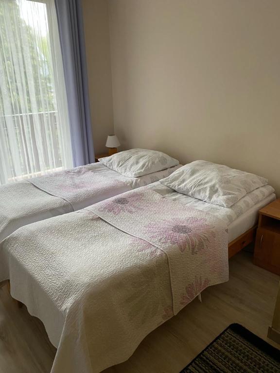 Posteľ alebo postele v izbe v ubytovaní Willa Potoki