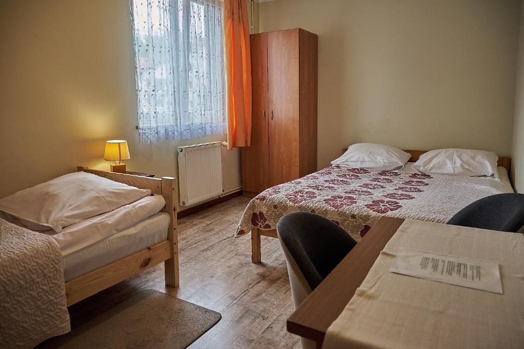 Posteľ alebo postele v izbe v ubytovaní Willa Potoki