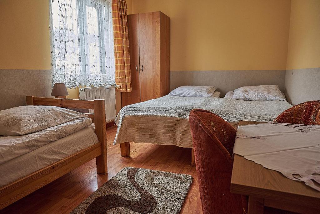 Posteľ alebo postele v izbe v ubytovaní Willa Potoki