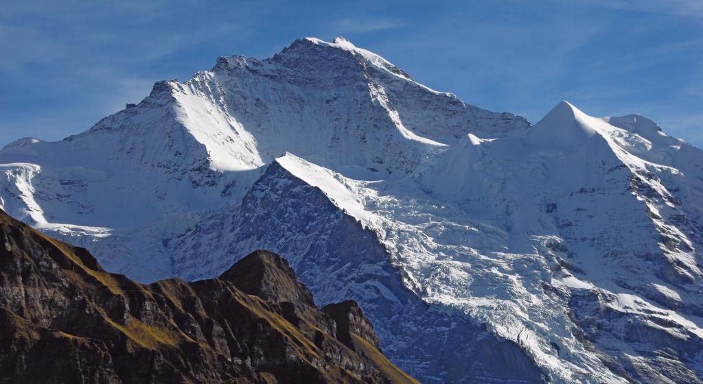 a view of a snow covered mountain at Camping Jungfrau in Lauterbrunnen