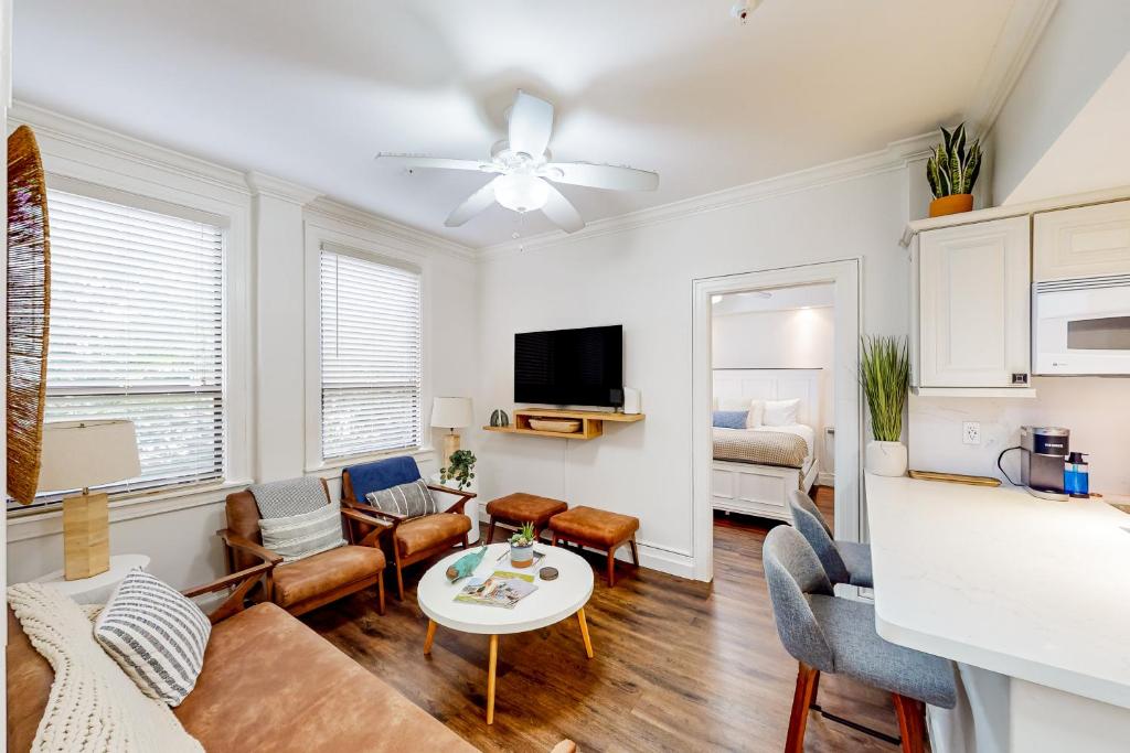 a living room with a couch and a table at Sunrise Suite #2232 in Palm Beach