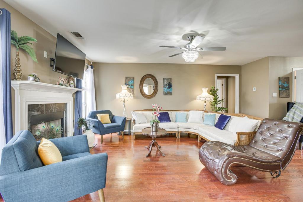 a living room with a couch and chairs at Spacious Family-Friendly Home in Denham Springs! in Denham Springs