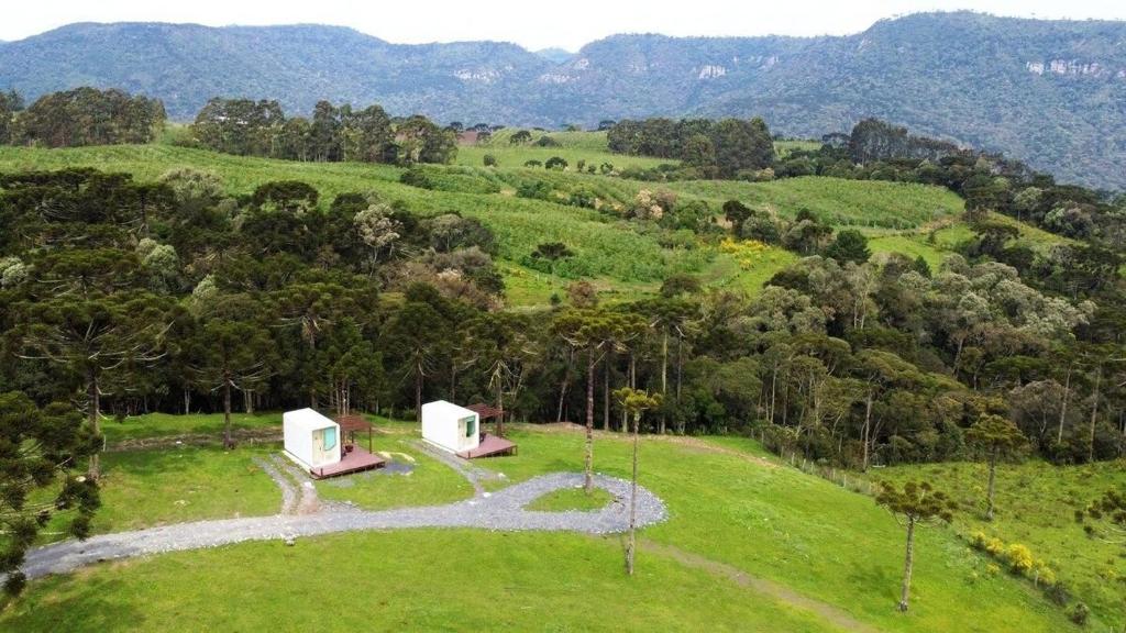 an aerial view of a house in a field at Cápsula futurística - Experiência única. in Urubici