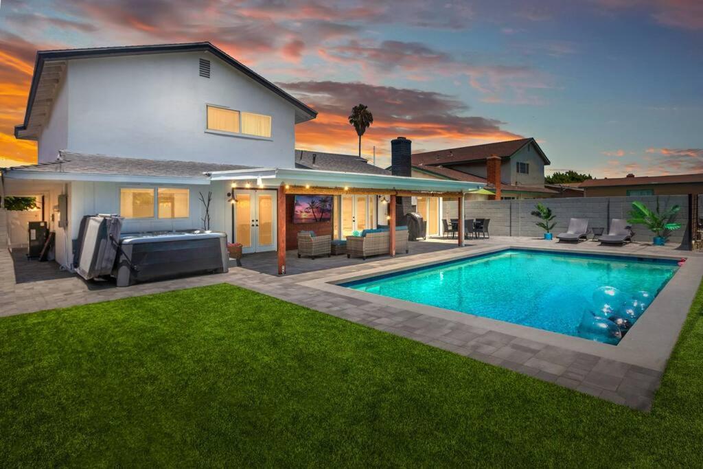 a house with a swimming pool in the yard at Huntington Beach, AC, Pool, Hot Tub, Detached Office, Close to Beach, Outside Entertaining Area in Huntington Beach