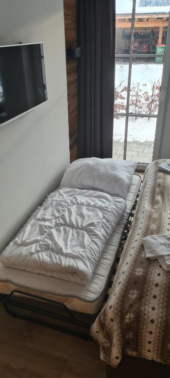 Posteľ alebo postele v izbe v ubytovaní Hochkönig Ferien