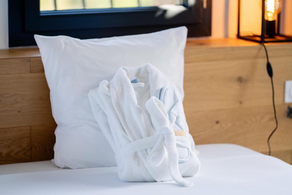 Postel nebo postele na pokoji v ubytování Mas Sureda - Evasion luxueuse avec vue panoramique