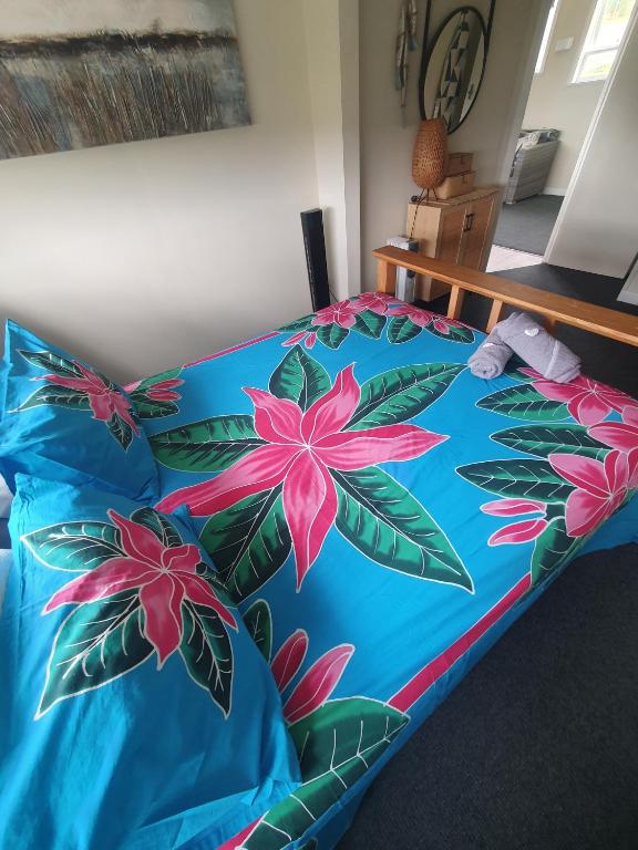 Voodi või voodid majutusasutuse Stanmore Bay Beachfront Cottage toas