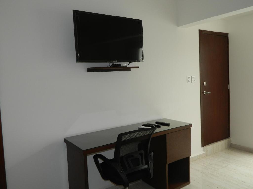 TV a/nebo společenská místnost v ubytování ACL Suites