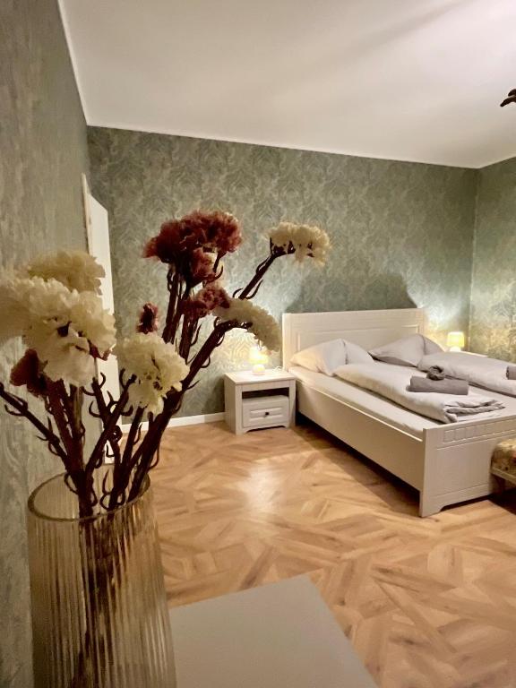 Postel nebo postele na pokoji v ubytování Apartments Zámoček Staré časy