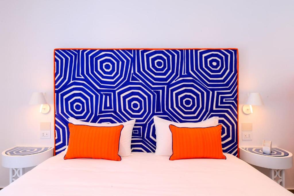 A bed or beds in a room at My Exclusive Italy - Beachfront Villa Sorrento & private sea access