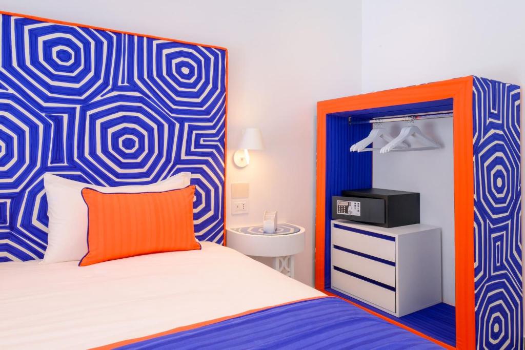 A bed or beds in a room at My Exclusive Italy - Beachfront Villa Sorrento & private sea access