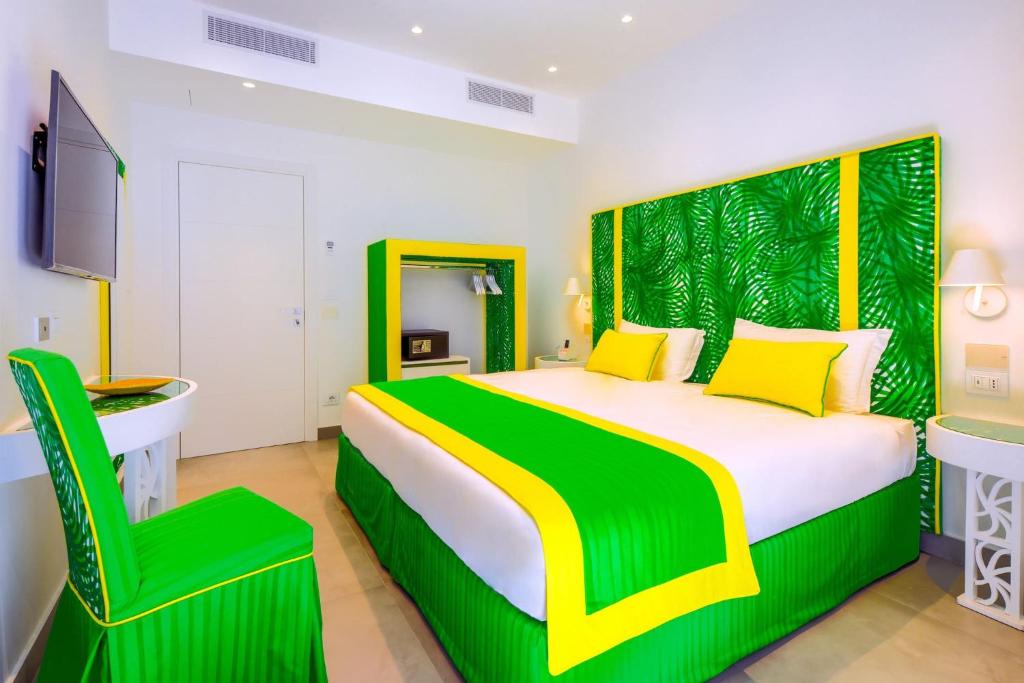 A bed or beds in a room at My Exclusive Italy - Beachfront Villa Sorrento & private sea access