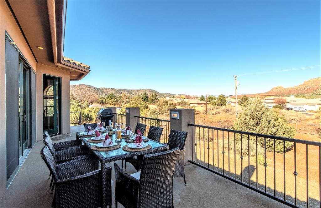 a table on the balcony of a house at Great Sedona Home Sensational Views! in Sedona