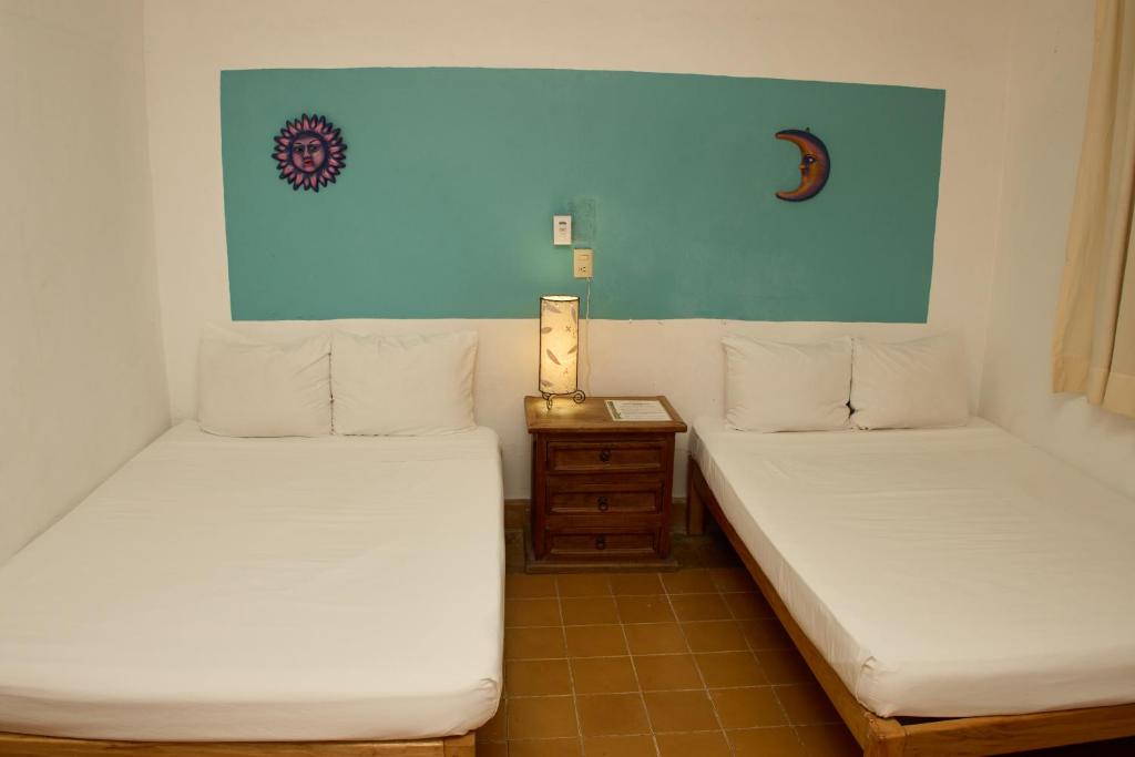 Postel nebo postele na pokoji v ubytování Hotel San Lorenzo