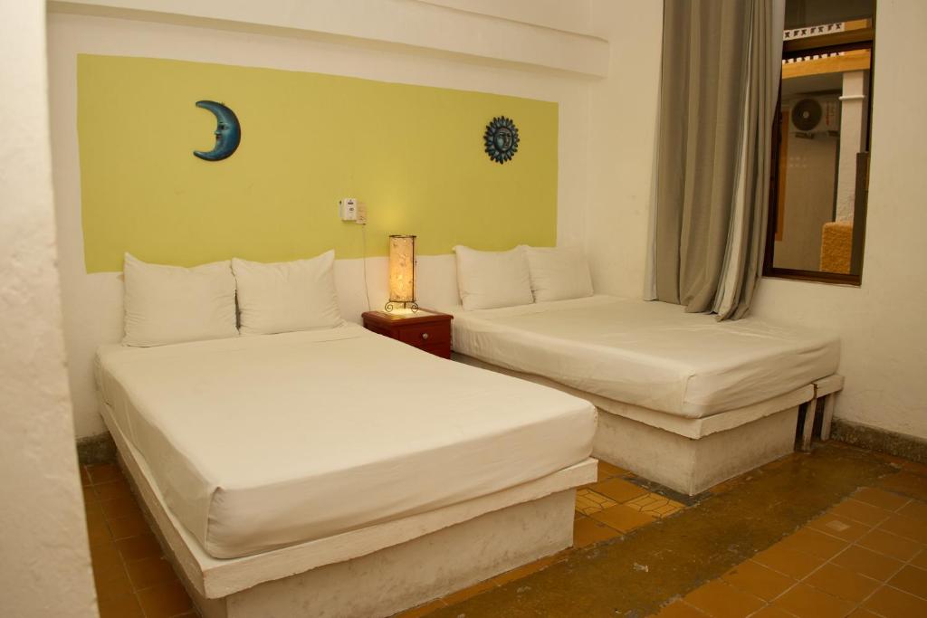 Postel nebo postele na pokoji v ubytování Hotel San Lorenzo