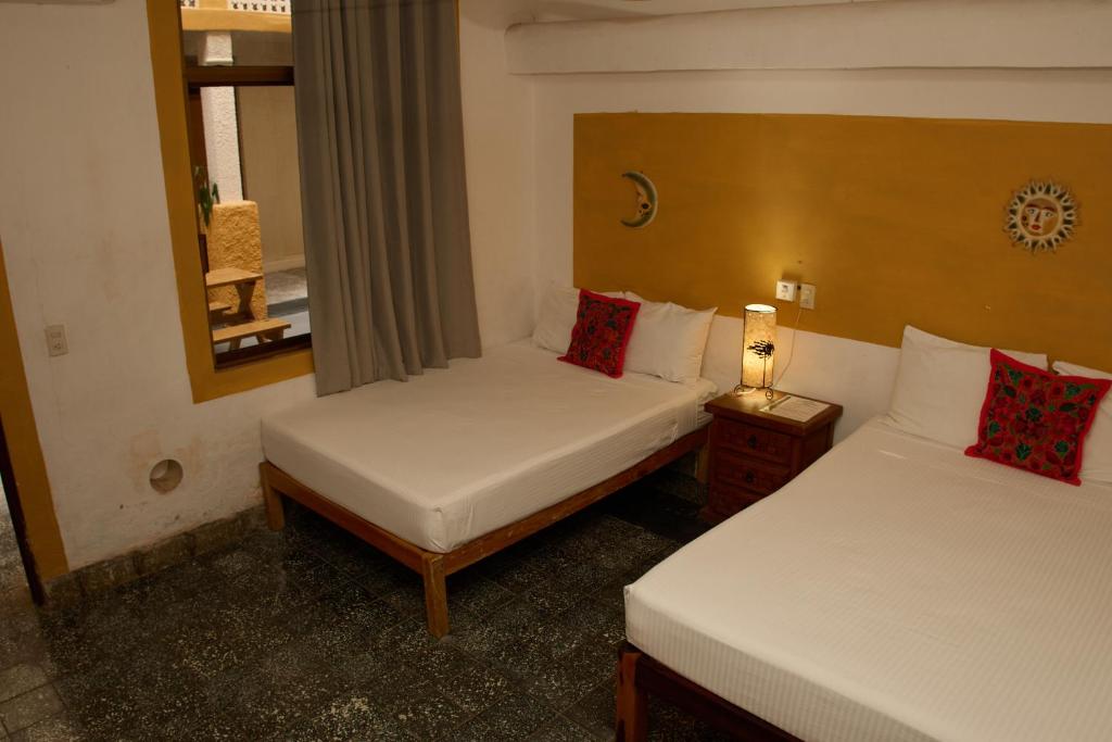 Postel nebo postele na pokoji v ubytování Hotel San Lorenzo