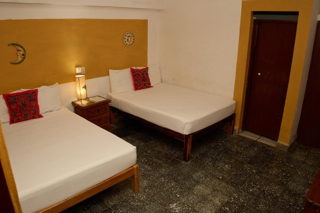 Postel nebo postele na pokoji v ubytování Hotel San Lorenzo