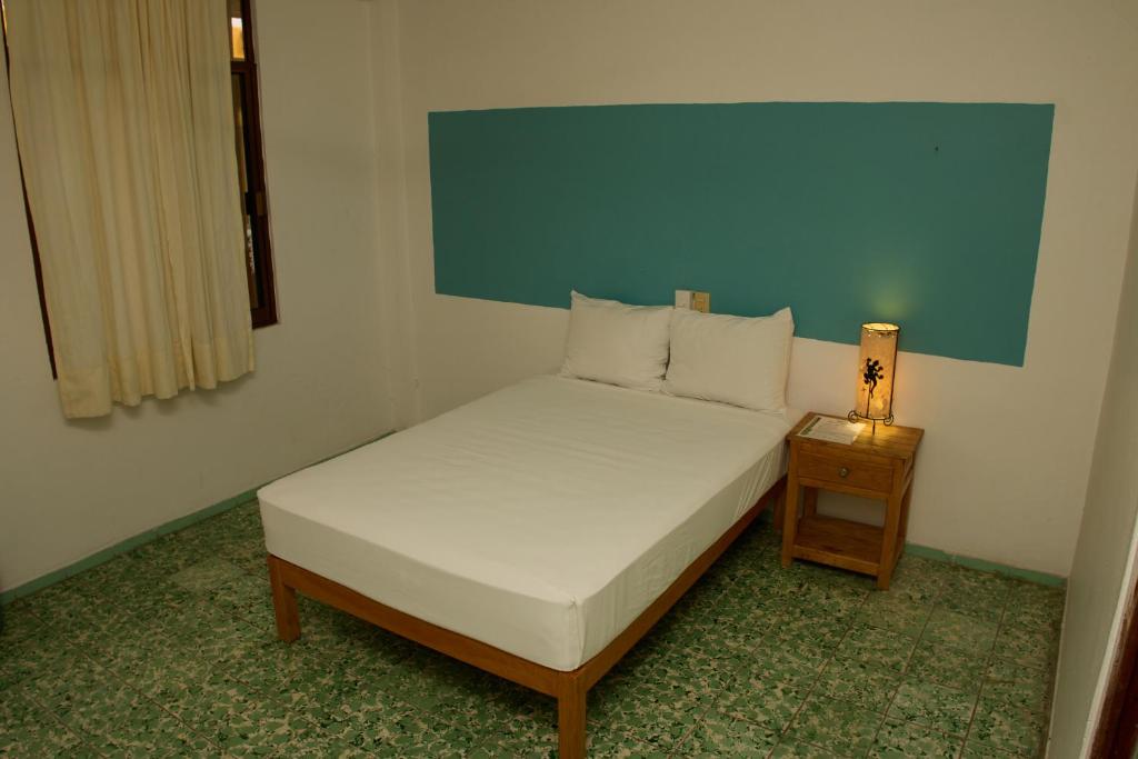Postel nebo postele na pokoji v ubytování Hotel San Lorenzo