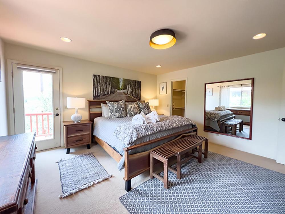 a bedroom with a bed and a large mirror at The Dahl House Of Sedona in Sedona