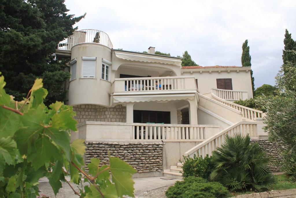 an image of a house with a staircase at Apartments by the sea Lukoran (Ugljan) - 8494 in Lukoran