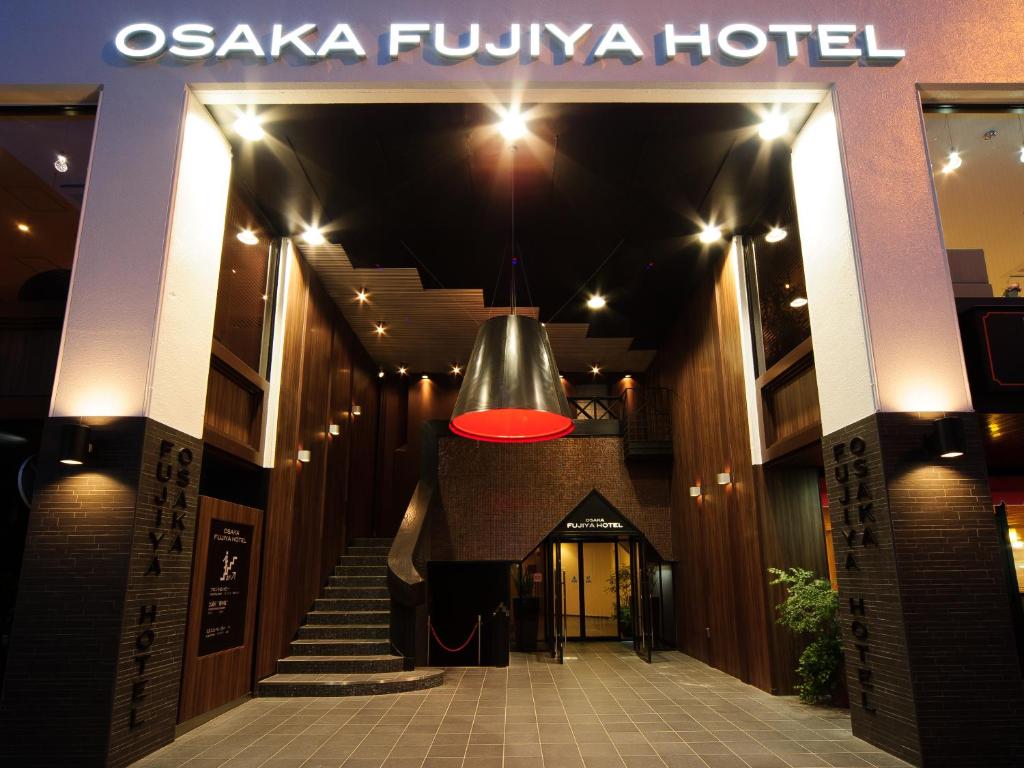 a red light is hanging from a building at Osaka Fujiya Hotel in Osaka