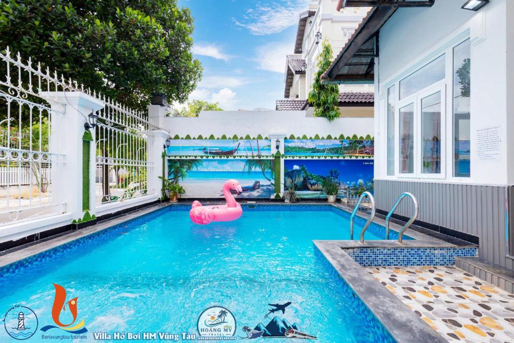 a swimming pool with a pink flamingo in a house at Villages HOÀNG ĐỨC Bãi Sau có bàn bida karaoke in Vung Tau