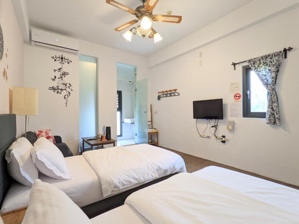 Postel nebo postele na pokoji v ubytování Hoyu''s House B&B