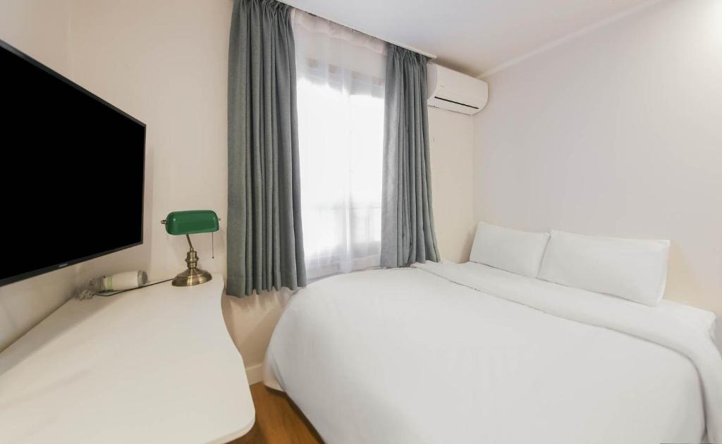 Postel nebo postele na pokoji v ubytování Lofy house