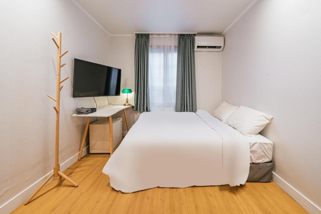 Postel nebo postele na pokoji v ubytování Lofy house
