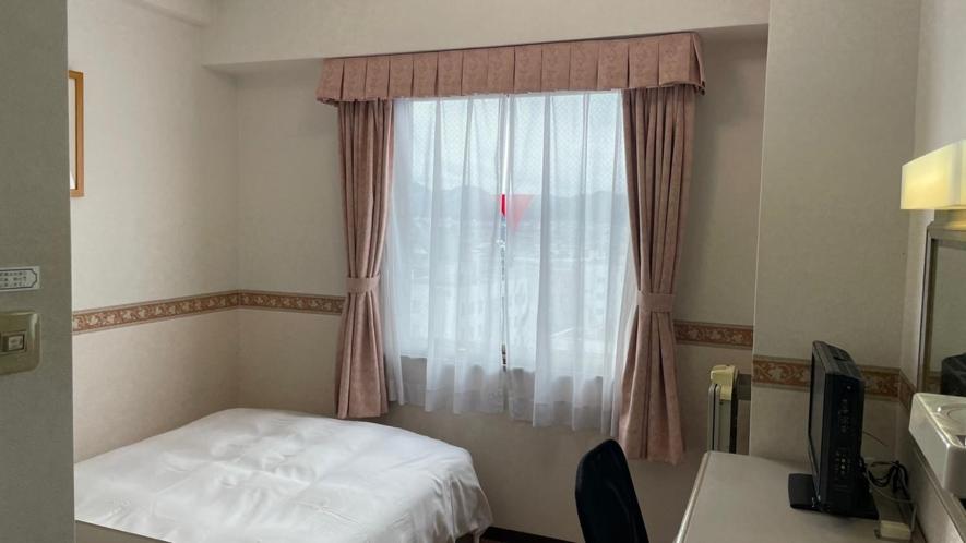 Postel nebo postele na pokoji v ubytování Hotel Alpha-One Sabae