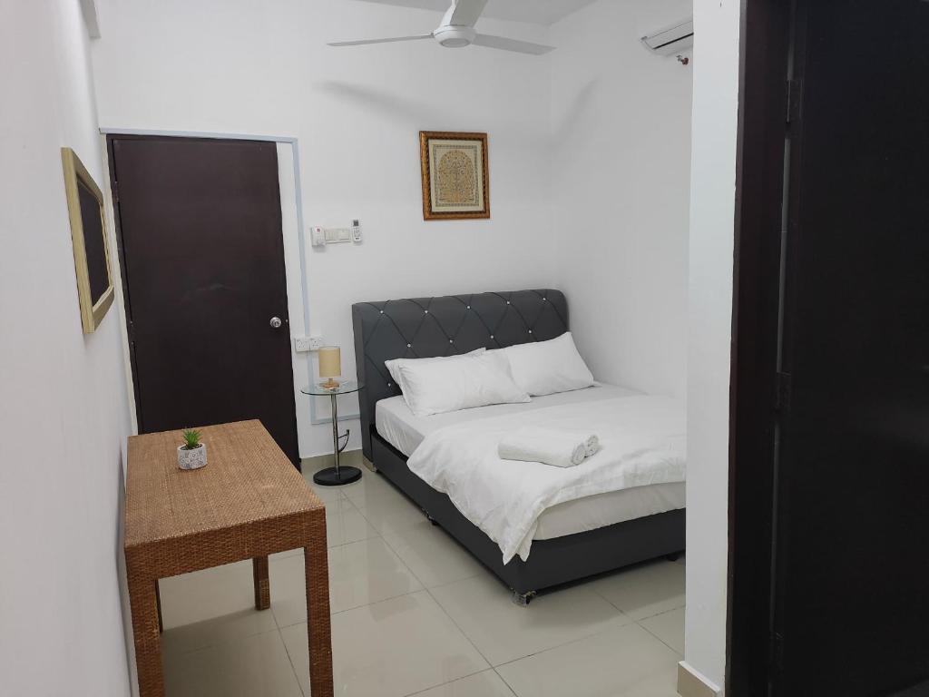 Postel nebo postele na pokoji v ubytování Homestay Studio Apartment Bentara Suite, Kompleks Mutiara Gua Musang