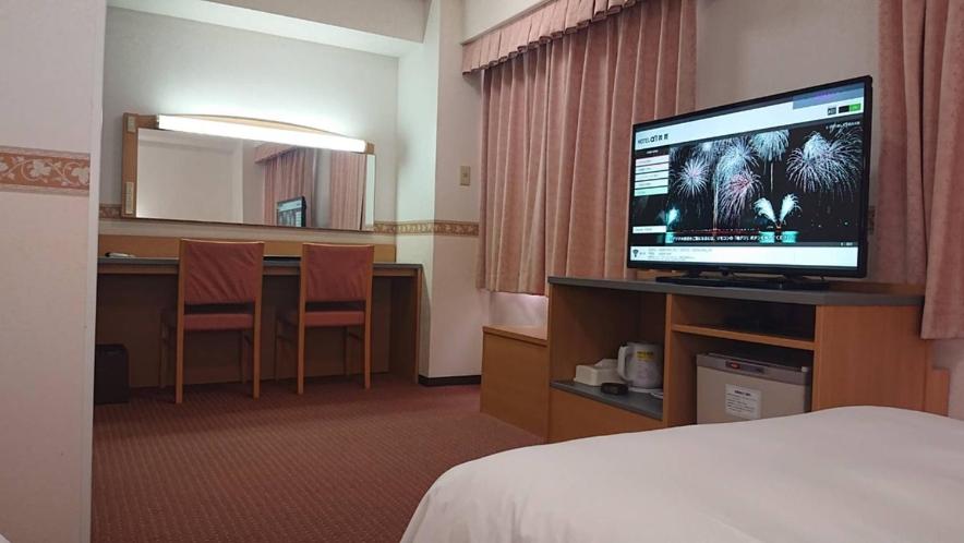TV a/nebo společenská místnost v ubytování Hotel Alpha-One Tsuruga