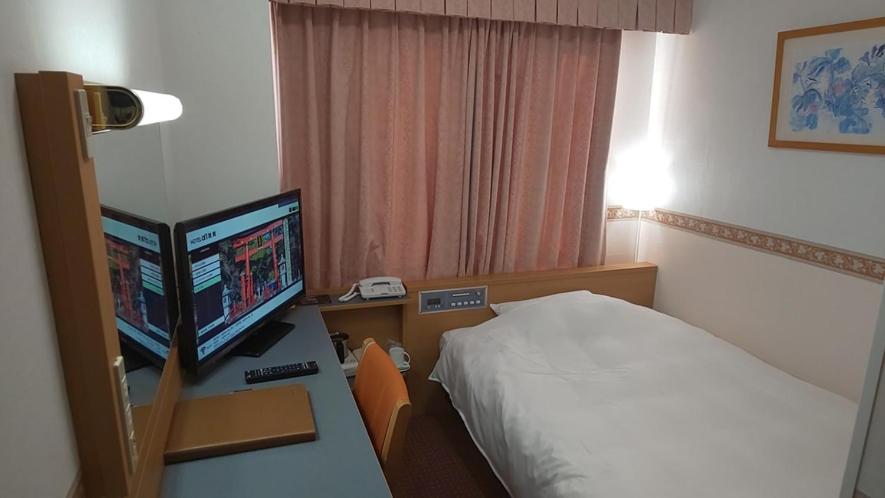 Postel nebo postele na pokoji v ubytování Hotel Alpha-One Tsuruga