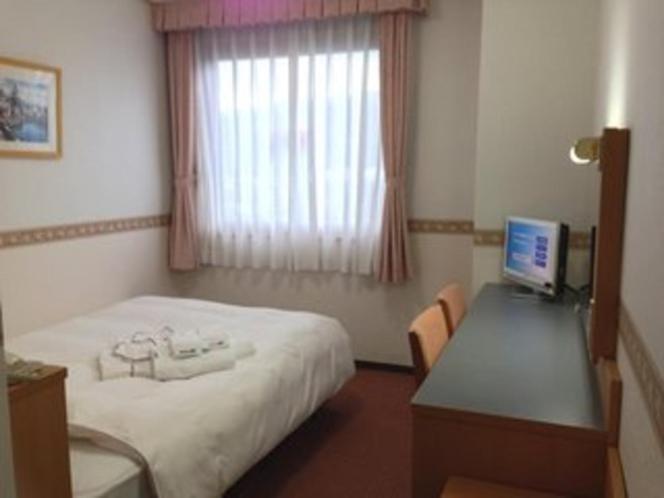 Postel nebo postele na pokoji v ubytování Hotel Alpha-One Tsuruga Bypass