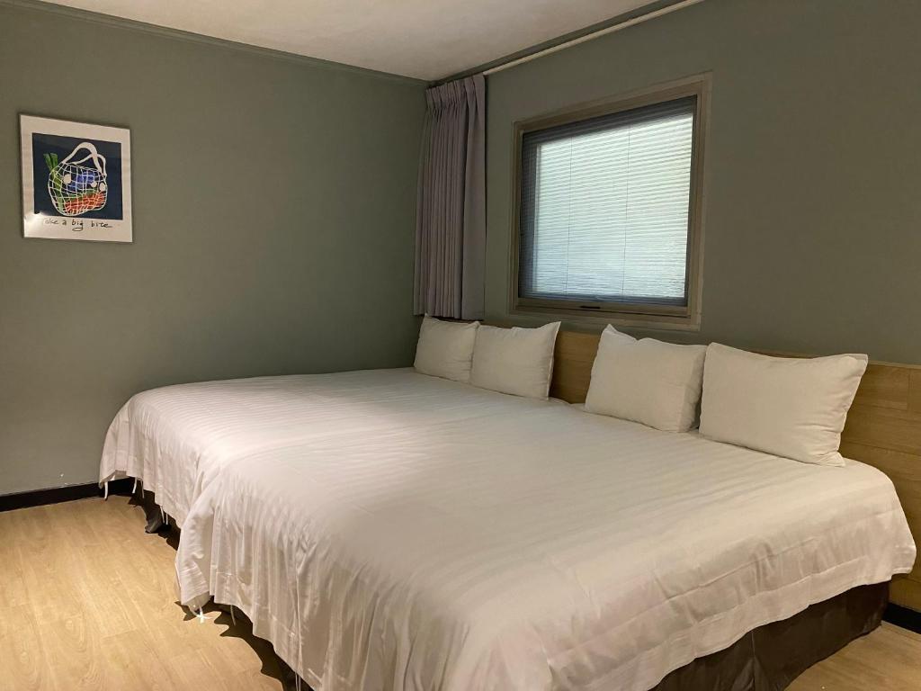 Postel nebo postele na pokoji v ubytování Prince Hotel