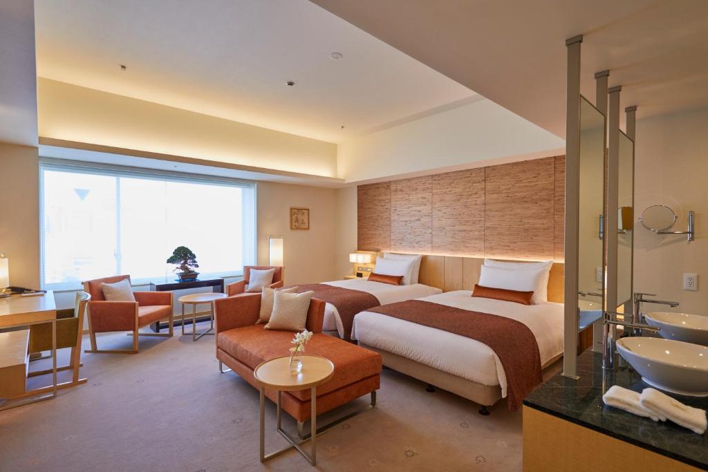 Postel nebo postele na pokoji v ubytování THE KITANO HOTEL TOKYO