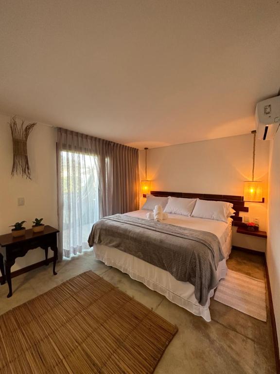 Letto o letti in una camera di Joju Bangalôs & Bistrô