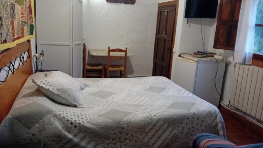 A bed or beds in a room at "Casa Ibero" Bubion, Alojamiento Turistico Rural
